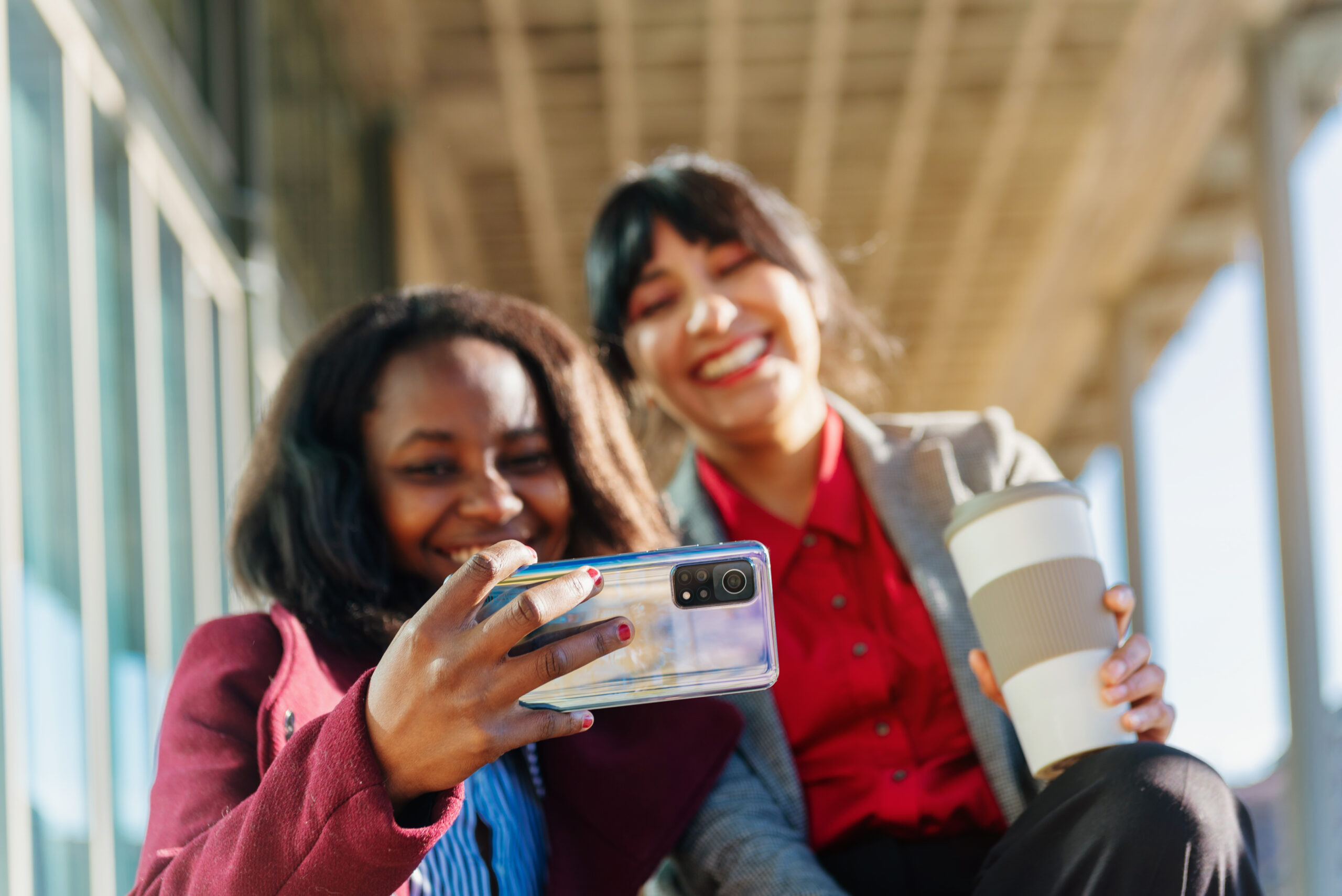 Two multiracial office worker women